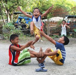 Kids playing Luksong Tinik